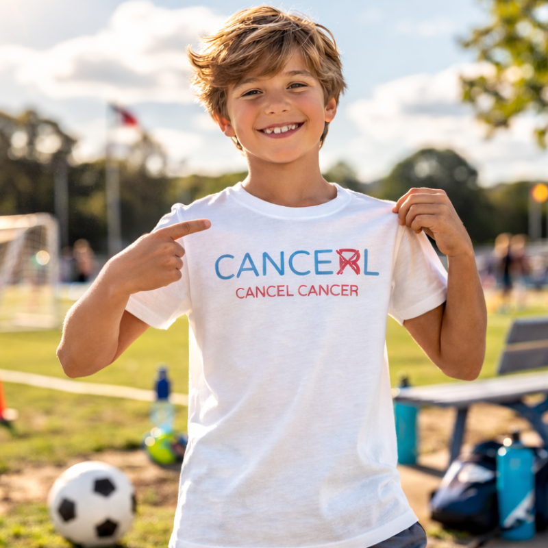 Child wearing a Cancel Cancer t-shirt at a sports event